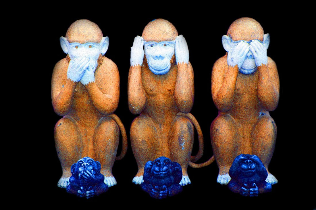 Two sets of monkey statues in the speak no evil, hear no evil, see no evil configuration.